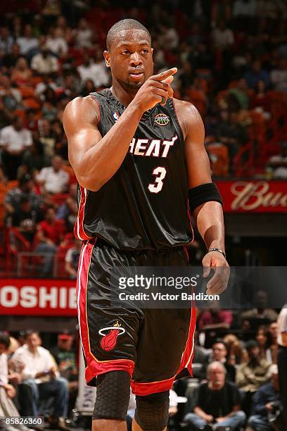 Dwyane Wade of the Miami Heat points across the court during the game against the Chicago Bulls on March 9, 2009 at American Airlines Arena in Miami,...