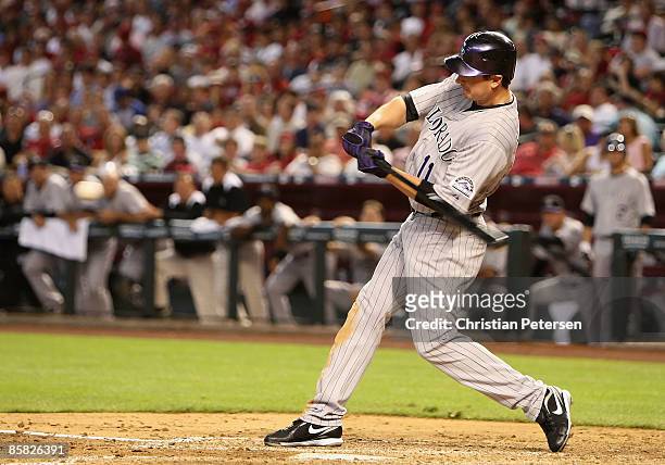 Brad Hawpe of the Colorado Rockies hits a 3 RBI double against the Arizona Diamondbacks during the third inning of the MLB openning day game at Chase...