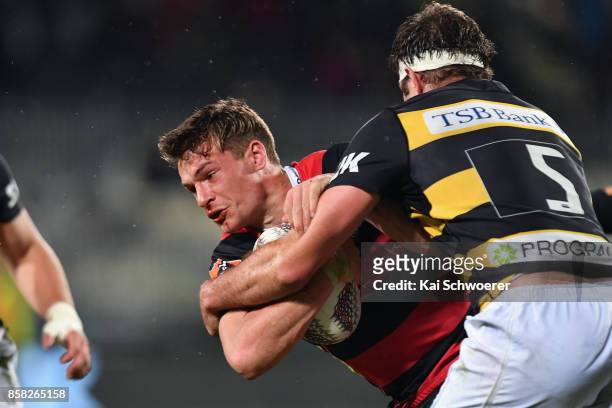 George Bridge of Canterbury is tackled by Leon Power of Taranaki during the round eight Mitre 10 Cup match between Canterbury and Taranaki at AMI...