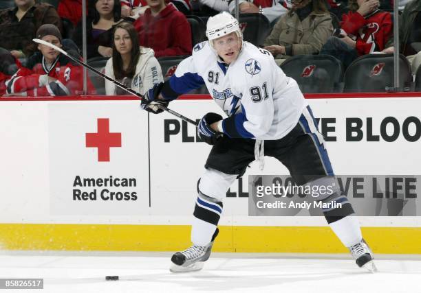 Steven Stamkos of the Tampa Bay Lightning takes a shot against the New Jersey Devils at the Prudential Center on April 3, 2009 in Newark, New Jersey....