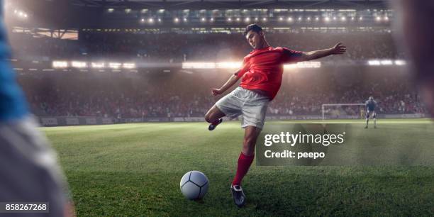 soccer player about to take free kick during football game - football player stock pictures, royalty-free photos & images