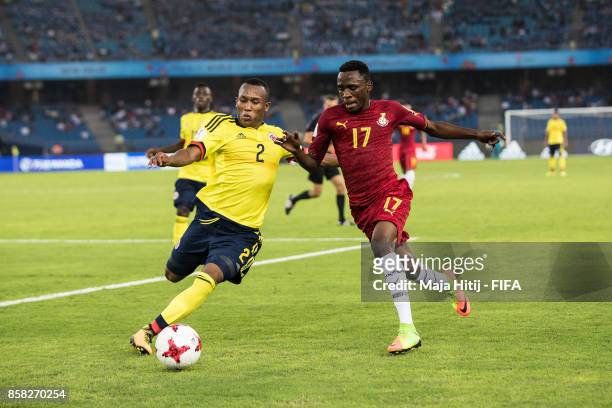 Rashid Alhassan of Ghana and Andres Cifuentes of Columbia battle for the ballduring the FIFA U-17 World Cup India 2017 group A match between Colombia...