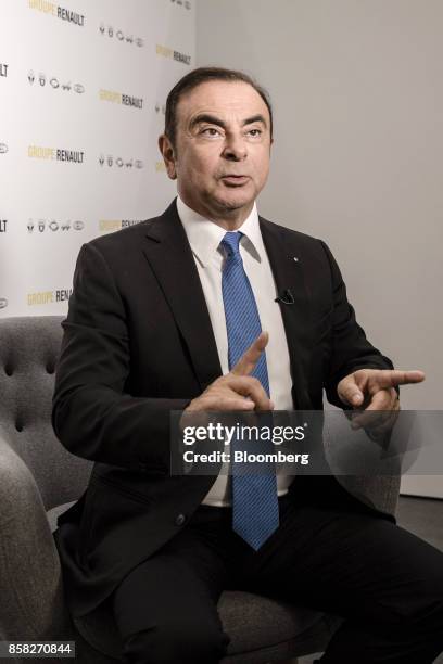Carlos Ghosn, chairman of Renault SA, gestures as he speaks ahead of a Bloomberg Television interview following a news conference to announce the...