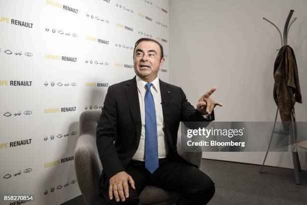 Carlos Ghosn, chairman of Renault SA, gestures as he speaks ahead of a Bloomberg Television interview following a news conference to announce the...