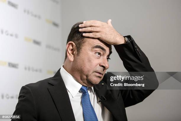 Carlos Ghosn, chairman of Renault SA, pauses ahead of a Bloomberg Television interview following a news conference to announce the automaker's...