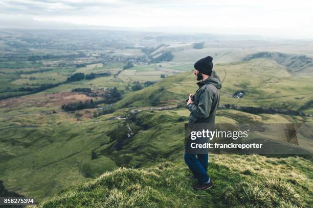 man hiking in the peak district - peak district national park stock pictures, royalty-free photos & images