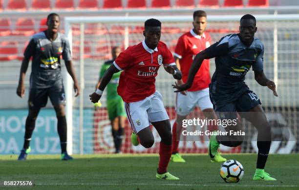 Real SC forward Abdoulaye Diallo from Senegal with SL Benfica forward Heriberto Tavares from Portugal in action during the Segunda Liga match between...