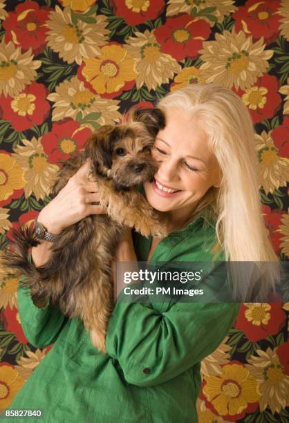 mature woman with puppy - 1 minute 50 stock pictures, royalty-free photos & images