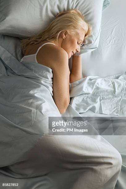 mature woman asleep - vertical foto e immagini stock