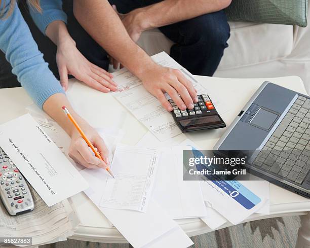 couple going over finances - billing accuracy stock pictures, royalty-free photos & images