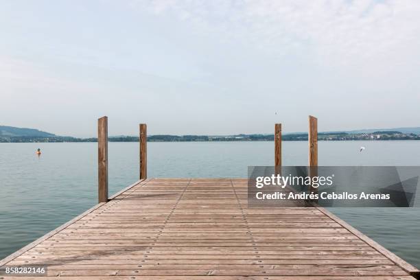 lake pier - wooden boat stock pictures, royalty-free photos & images