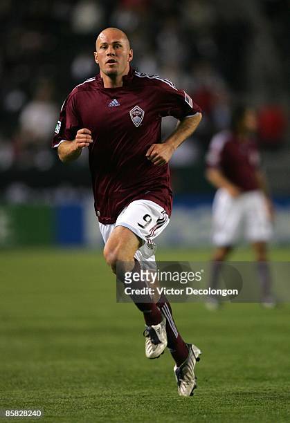 Conor Casey of the Colorado Rapids runs to the ball during the MLS match against the Los Angeles Galaxy at The Home Depot Center on April 4, 2009 in...