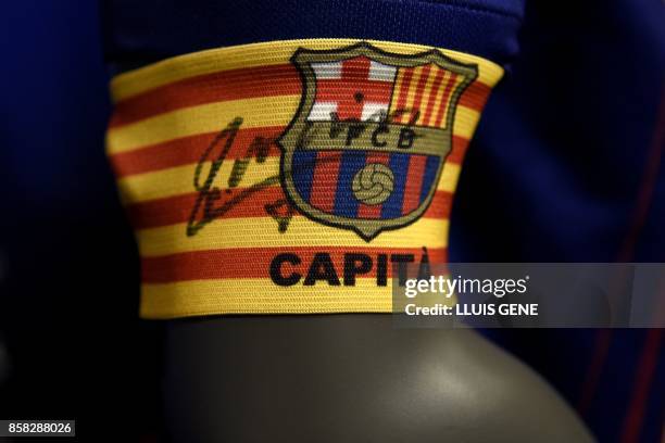 Picture shows a captain armband signed by FC Barcelona's midfielder Andres Iniesta after he renewed his contract at the Camp Nou in Barcelona on...