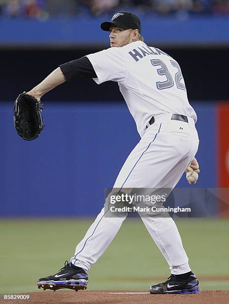 Roy Halladay of the Toronto Blue Jays pitches against the Detroit Tigers during the opening day game at the Rogers Centre on April 6, 2009 in...