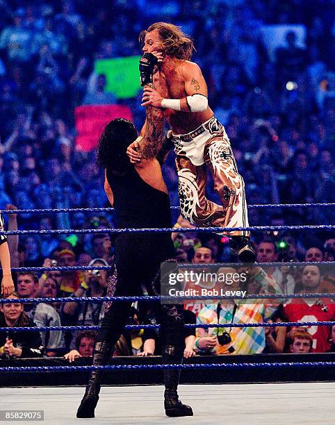 The Undertaker choke slams Shaw Michaels during their match at "WrestleMania 25" at the Reliant Stadium on April 5, 2009 in Houston, Texas.