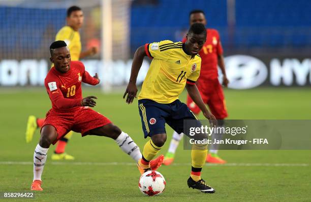 Juan Penaloza of Columbia battles with Emmanuel Toku of Ghana during the FIFA U-17 World Cup India 2017 group A match between Colombia and Ghana at...