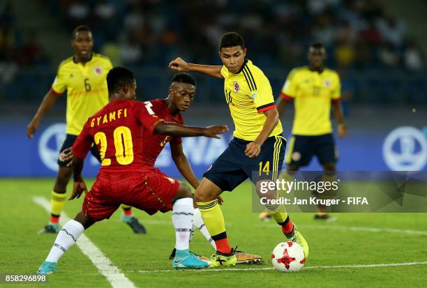 Yadir Meneses of Colombia battles with Isaac Gyamfi of Ghana during the FIFA U-17 World Cup India 2017 group A match between Colombia and Ghana at...