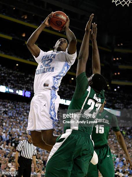 Ed Davis of the North Carolina Tar Heels drives for a shot attempt in the first half against Draymond Green of the Michigan State Spartans during the...