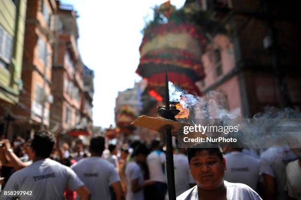 Devotees offering oil lamps during Lord Narayan jatra festival in Hadigaun, Kathmandu, Nepal on Friday, October 06, 2017. Once in a every year right...