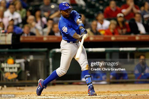 Alfonso Soriano of the Chicago Cubs gets a base hit against the Houston Astros on Opening Day on April 6, 2009 at Minute Maid Park in Houston, Texas.