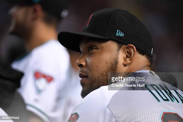 Yasmany Tomas of the Arizona Diamondbacks looks on from the bench during the National League Wild Card Game against the Colorado Rockies at Chase...