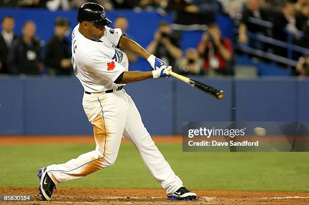 Vernon Wells of the Toronto Blue Jays hits an RBI single against the Detroit Tigers in the 8th inning during their MLB game at the Rogers Centre...