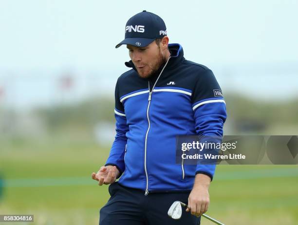 Tyrrell Hatton of England celebrates chipping in on the 16th hole during day two of the 2017 Alfred Dunhill Championship at Carnoustie on October 6,...