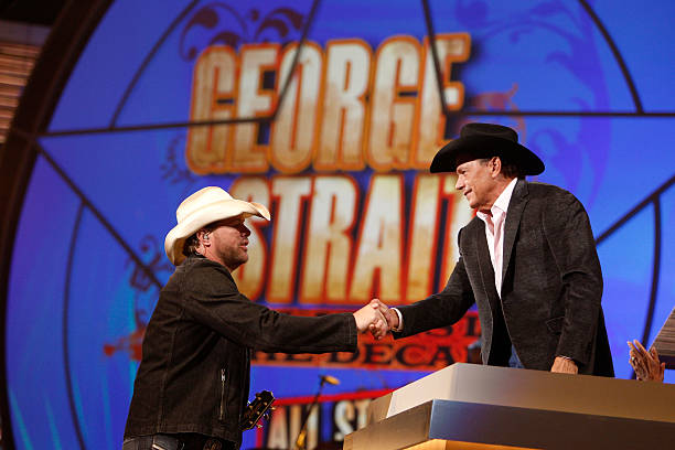 Performer Toby Keith greets honoree George Strait onstage during the 44th annual Academy Of Country Music Awards' Artist of the Decade held at the...