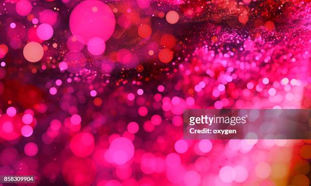 abstract pink bokeh sparkling spray circle - glamour stock-fotos und bilder