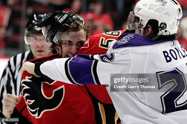 Matt Pelech of the Calgary Flames fights in his first NHL home game against Brian Boyle of the Los Angeles Kings on April 6, 2009 at Pengrowth...
