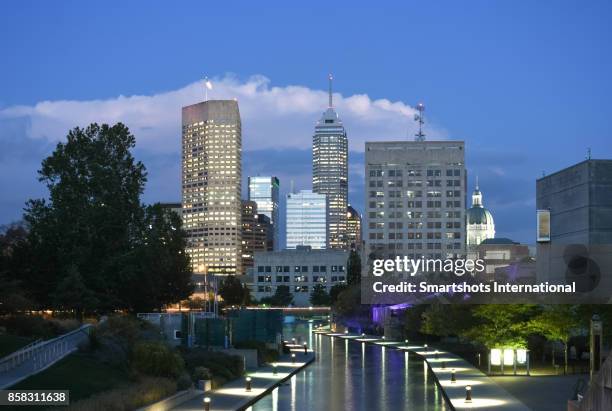 indianapolis skyline with several skyscrapers illuminated at dusk in indiana state, usa - indiana skyline stock pictures, royalty-free photos & images