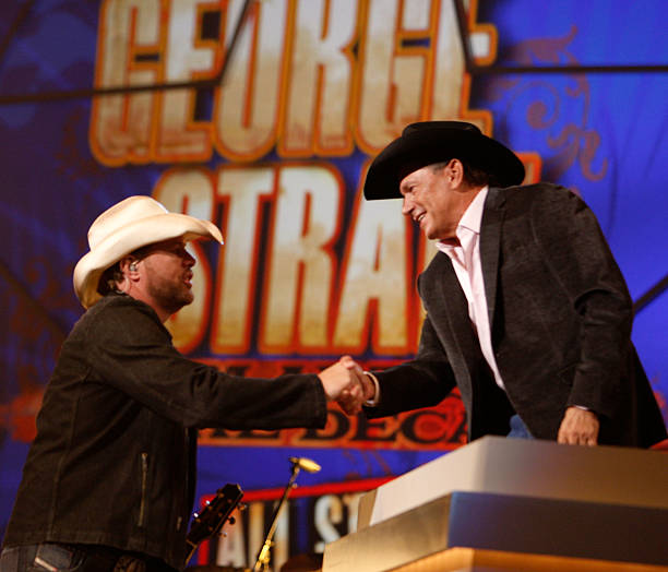 Performer Toby Keith greets honoree George Strait onstage during the 44th annual Academy Of Country Music Awards' Artist of the Decade held at the...