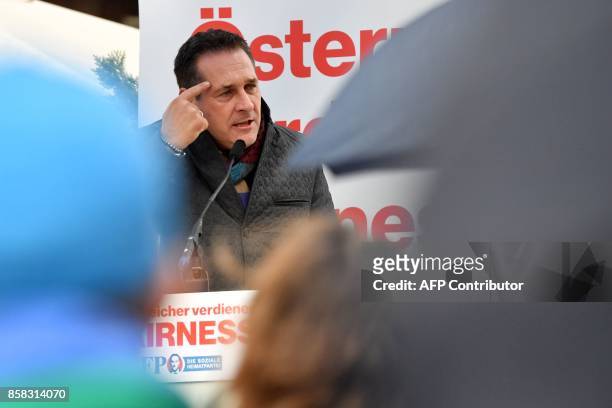 Heinz-Christian Strach, the chairman of the far-right Freedom Party of Austria , gestures as he speaks during a campaign meeting on October 6, 2017...