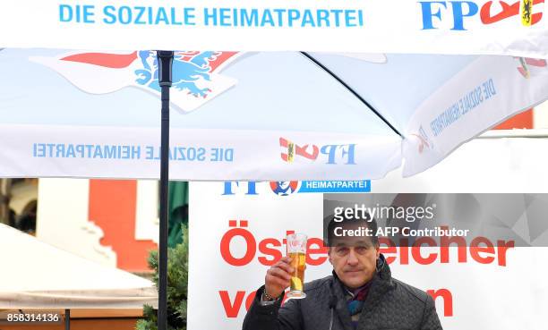 Heinz-Christian Strach, the chairman of the far-right Freedom Party of Austria , raises his glass during a campaign meeting on October 6, 2017 in...