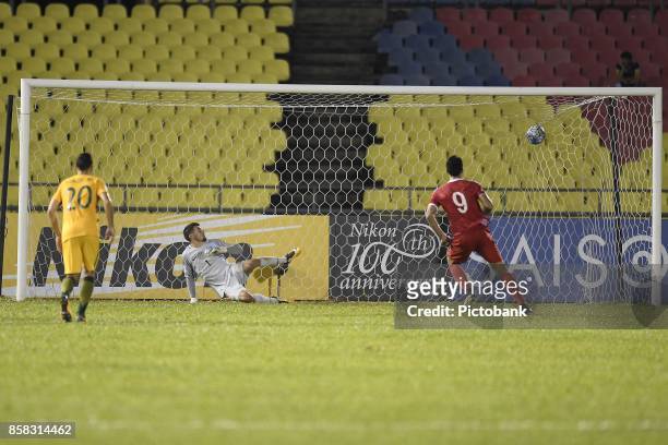 October 5: Omar Alsoma of Syria scores a penalty against Mathew Ryan of Australia during the FIFA 2018 World Cup Asian Playoff: Leg 1 match between...