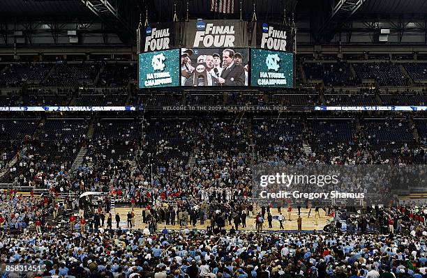 Head coach Roy Williams of the North Carolina Tar Heels celebrates as he is interviewed by CBS's Jim Nantz after defeating the Michigan State...