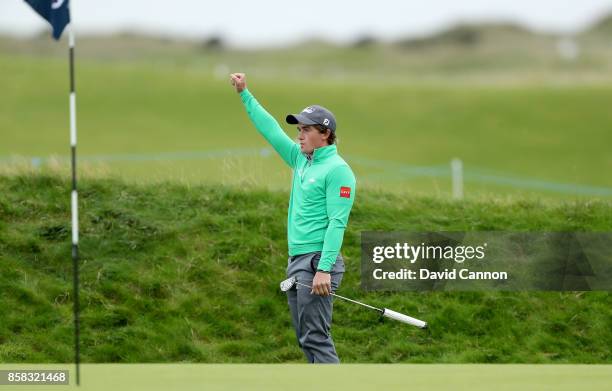 Paul Dunne of Ireland holes his second shot on the 16th hole for a birdie during the second round of the 2017 Alfred Dunhill Links Championship on...