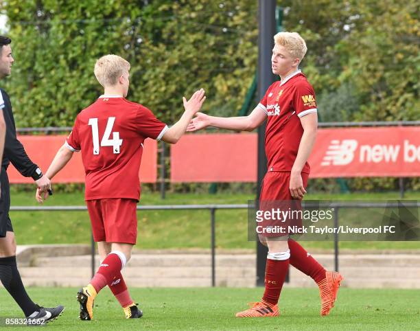 Luis Longstaff of Liverpool celebrates scoring his team's fourth goal with team mate Edvard Sandvik Tagseth during the U18 friendly match between...