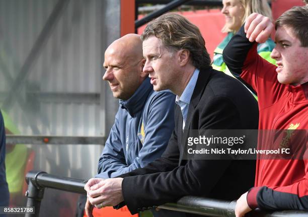 Rob Jones of Liverpool watches the action with his former Liverpool team mate Steve McManaman during the U18 friendly match between Liverpool and...