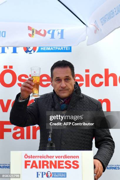 Heinz-Christian Strach, the chairman of the far-right Freedom Party of Austria , raises his glass during a campaign meeting on October 6, 2017 in...