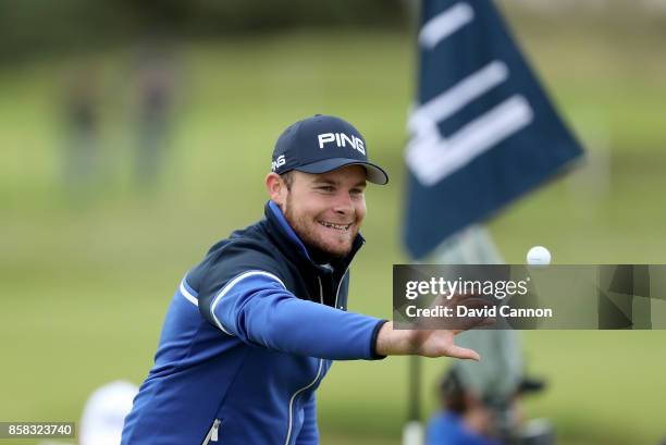 Tyrrell Hatton of England celebrates after he has holed his second shot on the 16th hole for a birdie during the second round of the 2017 Alfred...