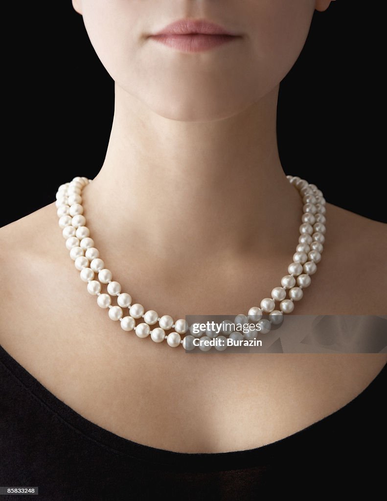 Woman wearing pearl necklace