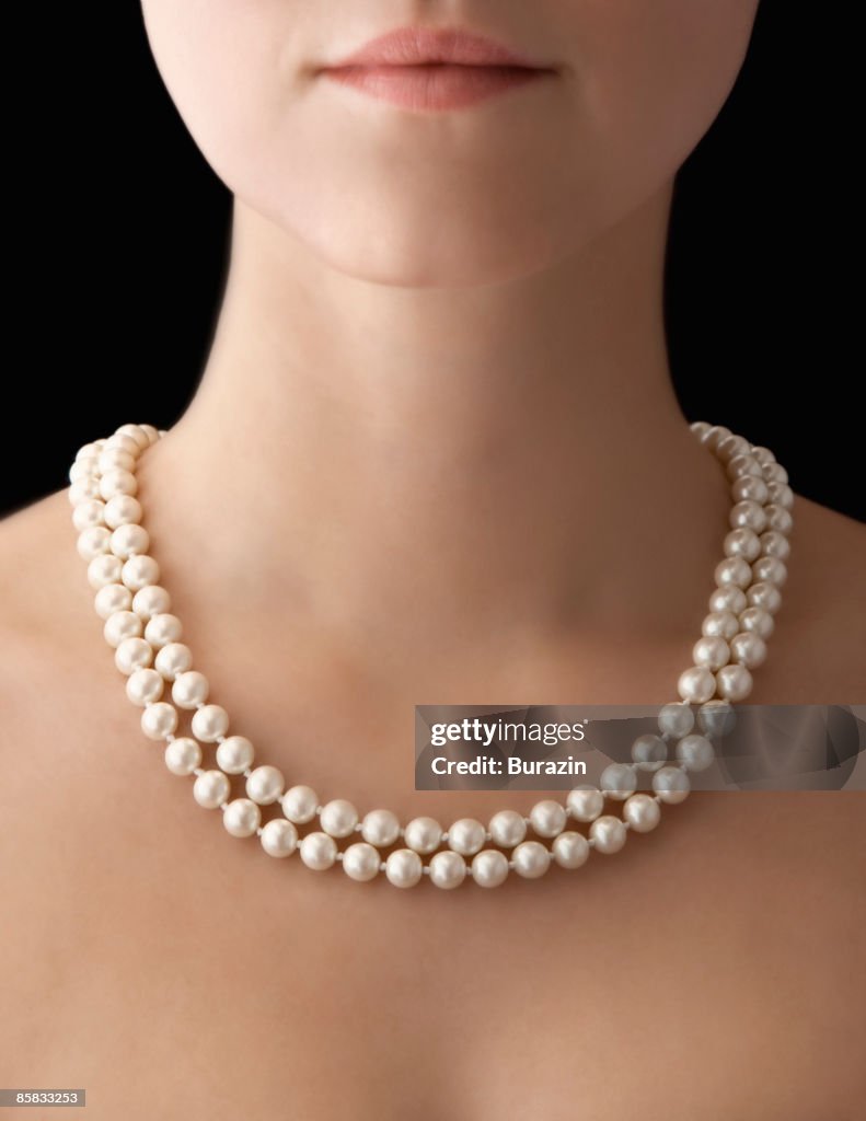 Woman wearing pearl necklace