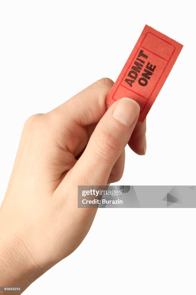 Woman's hand holding ticket