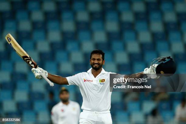 Dimuth Karunaratne of Sri Lanka celebrate after reaching his century during Day One of the Second Test between Pakistan and Sri Lanka at Dubai...