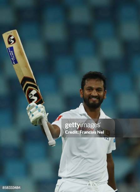 Dimuth Karunaratne of Sri Lanka celebrate after reaching his century during Day One of the Second Test between Pakistan and Sri Lanka at Dubai...