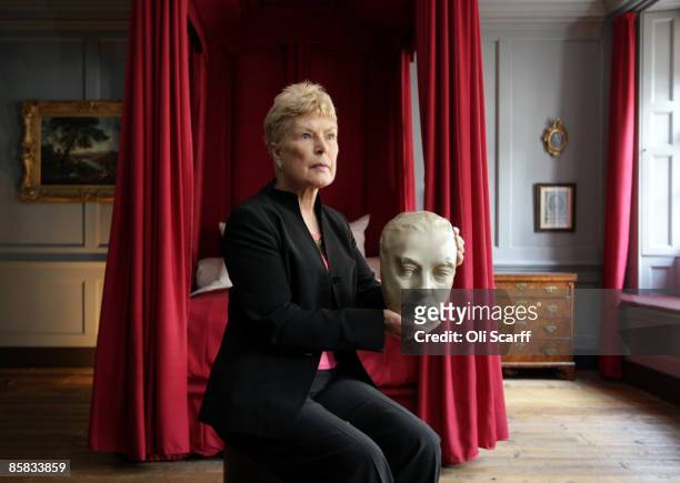 Ruth Rendell, crime novelist and patron of the Handel House Museum, holds a life mask of George Frideric Handel, in the room where the composer died...