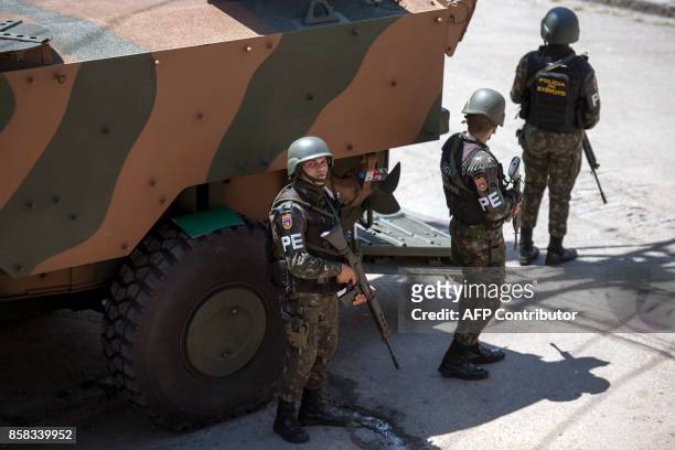 Brazilian Armed Forces soldiers patrol the Morro dos Macacos favela during a security operation in the area in Rio de Janeiro, Brazil on October 6,...
