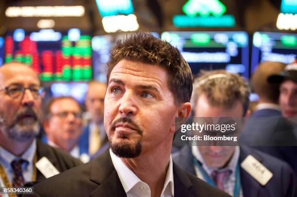 Rob Roy, founder and chief executive officer of Switch Inc., center, tours the floor of the New York Stock Exchange during the company's initial...