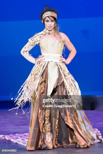 Model walks the runway wearing winning designs at the Metropolitan Fashion Week Closing Night Gala at Arcadia Performing Arts Center on October 5,...